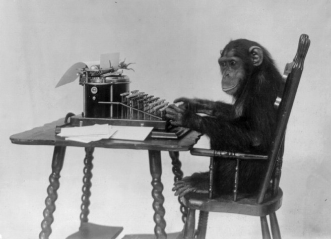 Chimpanzee seated at a typewriter.